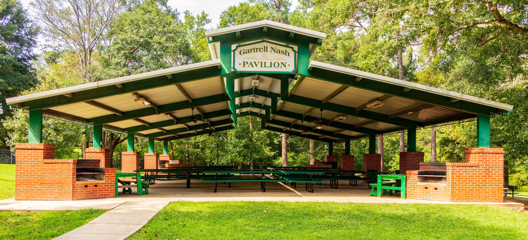 pavilion covering picnic tables on concrete slab